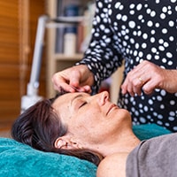 dr of acupuncture louise bennett treating a patient; service area: carina heights, east brisbane medical centre